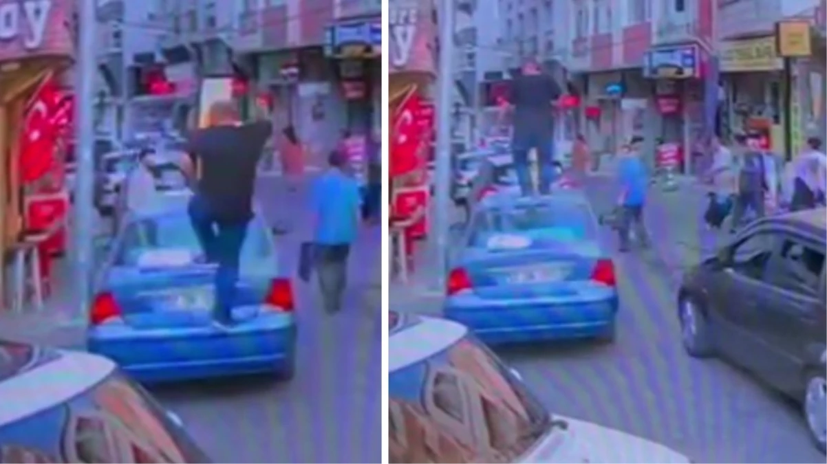 Trafikte tartıştığı adamın otomobilinin üzerine çıkıp tepindi! O anlar kamerada